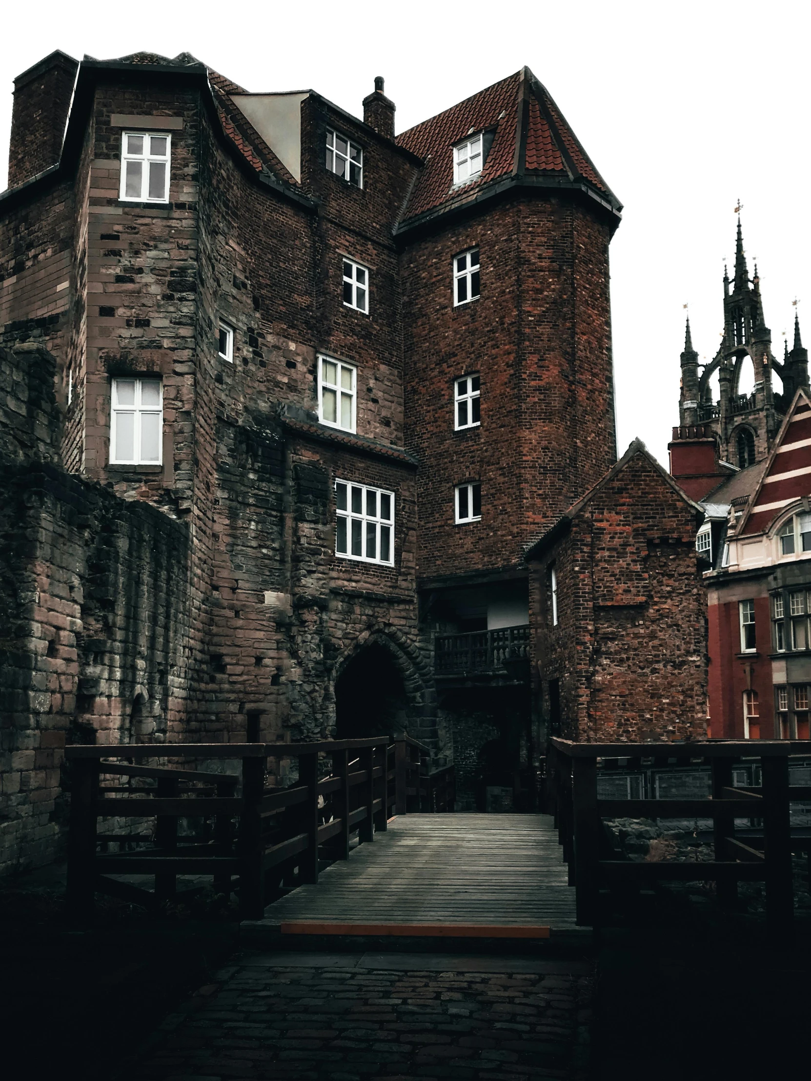 an old building made of brick with a gate