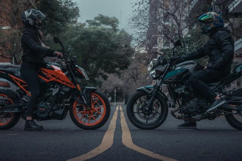 a couple of bikers that are on motorcycles