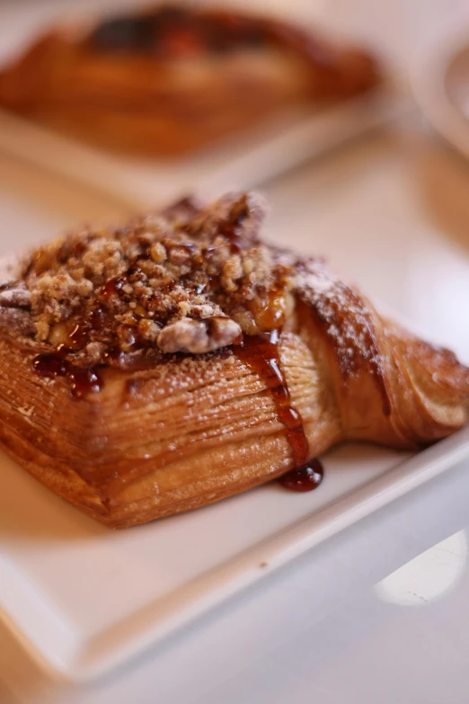 a pastry with chocolate on a white plate