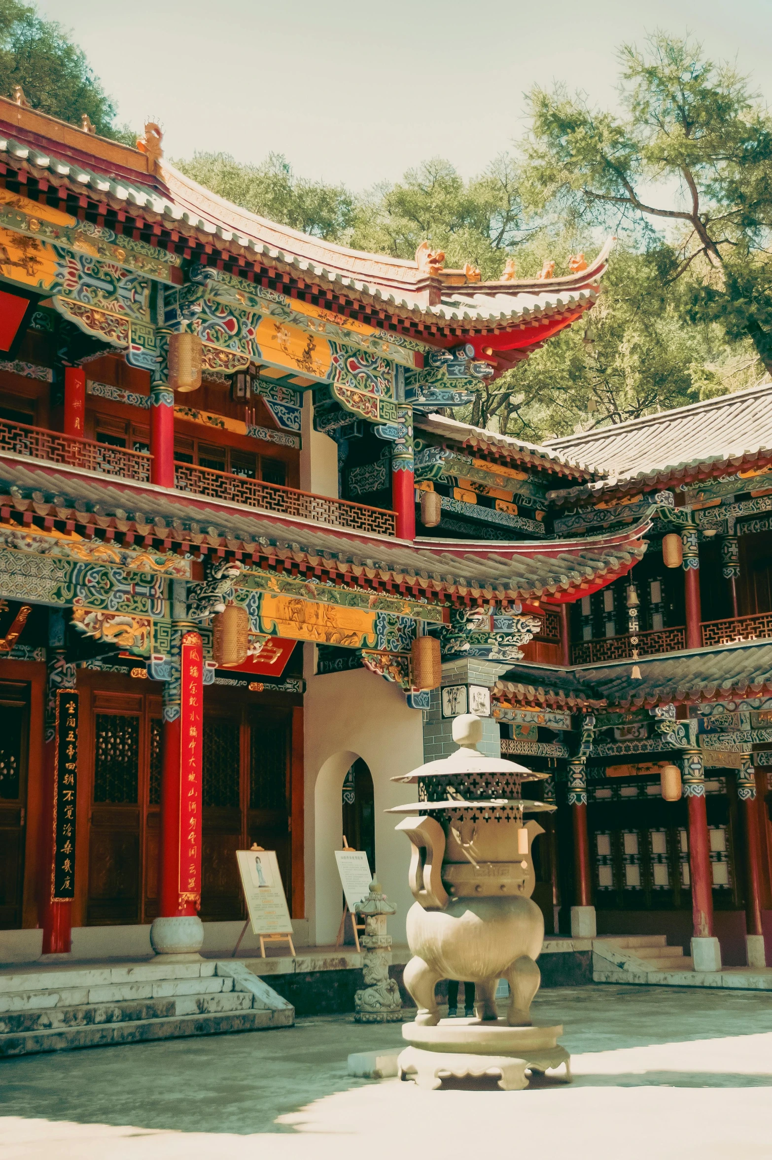 chinese architecture with the steps decorated in yellow, red, and white