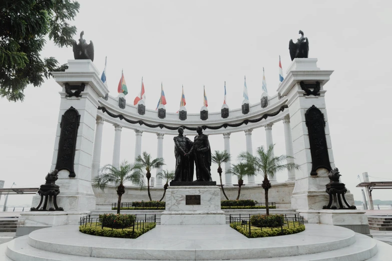 a statue with a bunch of flags sticking out of it