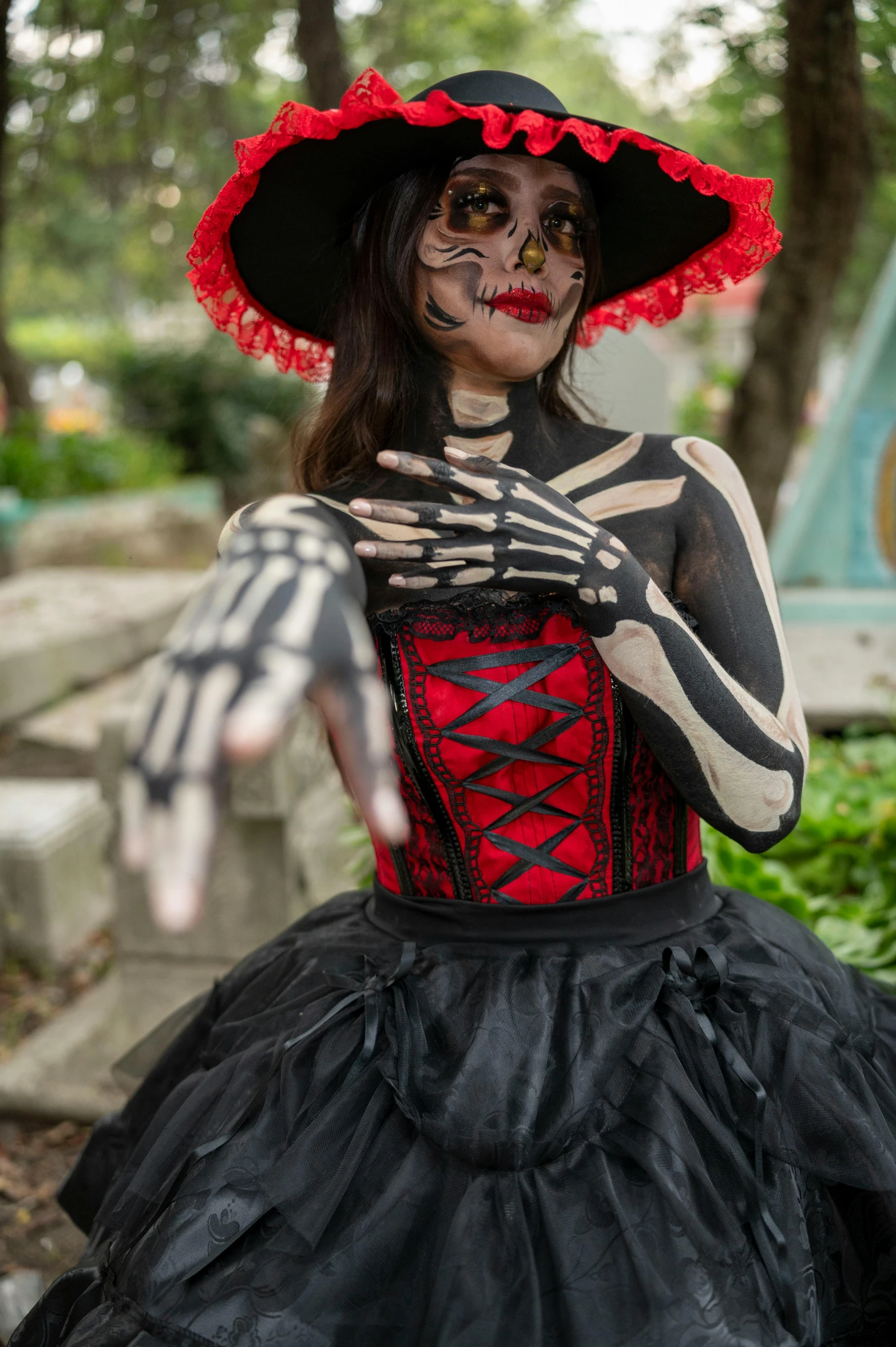 the woman is wearing a skeleton costume and black stockings