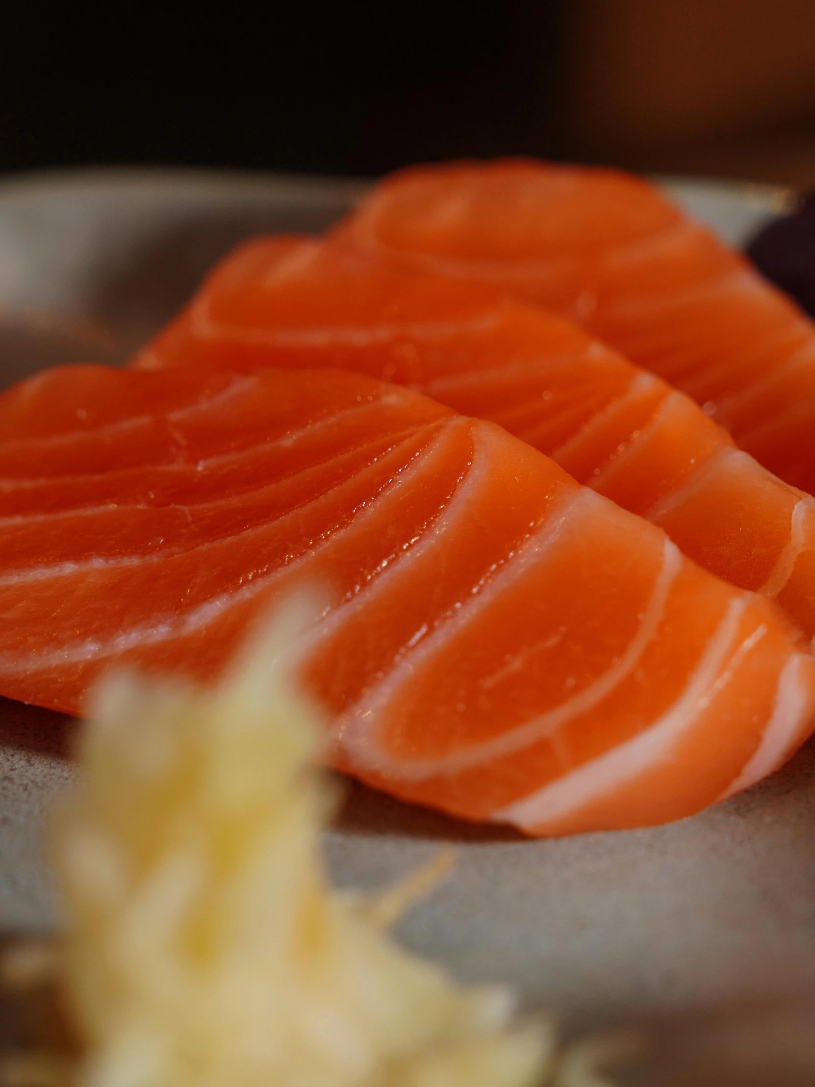 some cut up fish sitting on top of a table