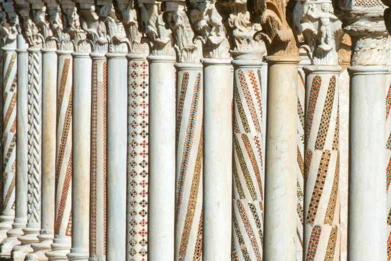 a line of decorative pillars lined with beads
