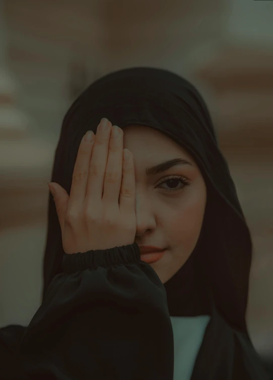 a beautiful young woman wearing black