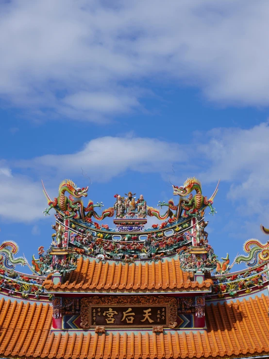 a tower with many chinese decorations on top