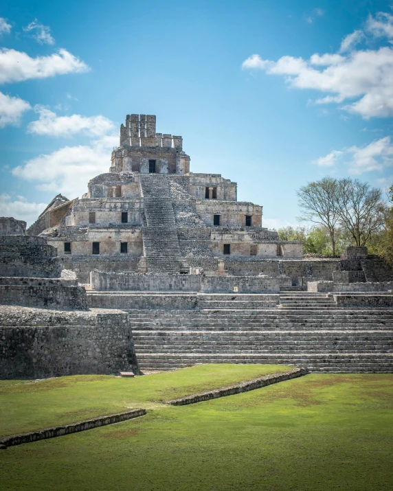 a big and ancient building that is in the grass