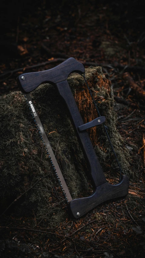 an outdoor camping tool resting on a rock