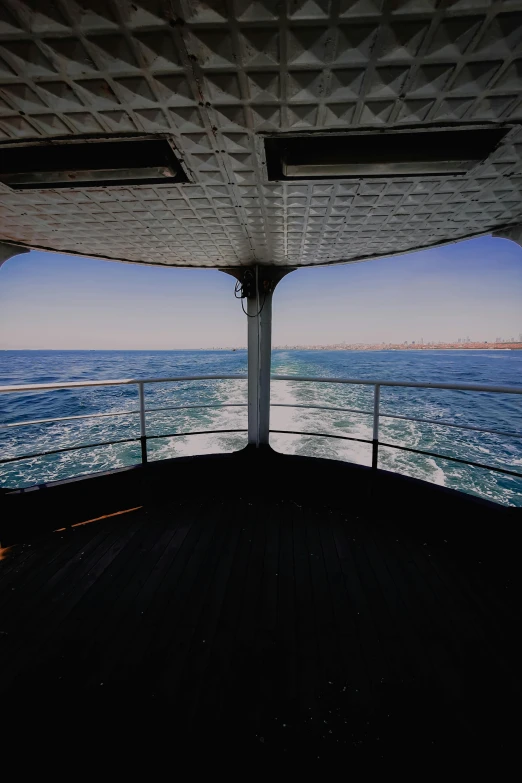 the view from inside a large ship looking at the ocean