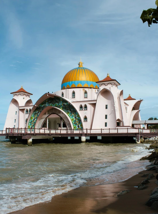 an elaborate building on the edge of the water