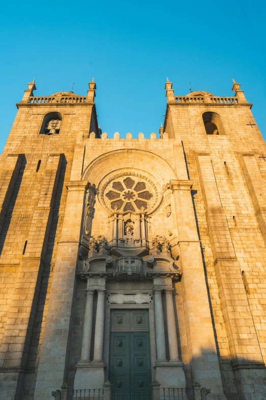 a very tall church with two towers and a clock