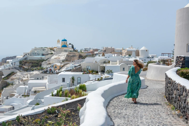 a woman is walking down the stairs in the village