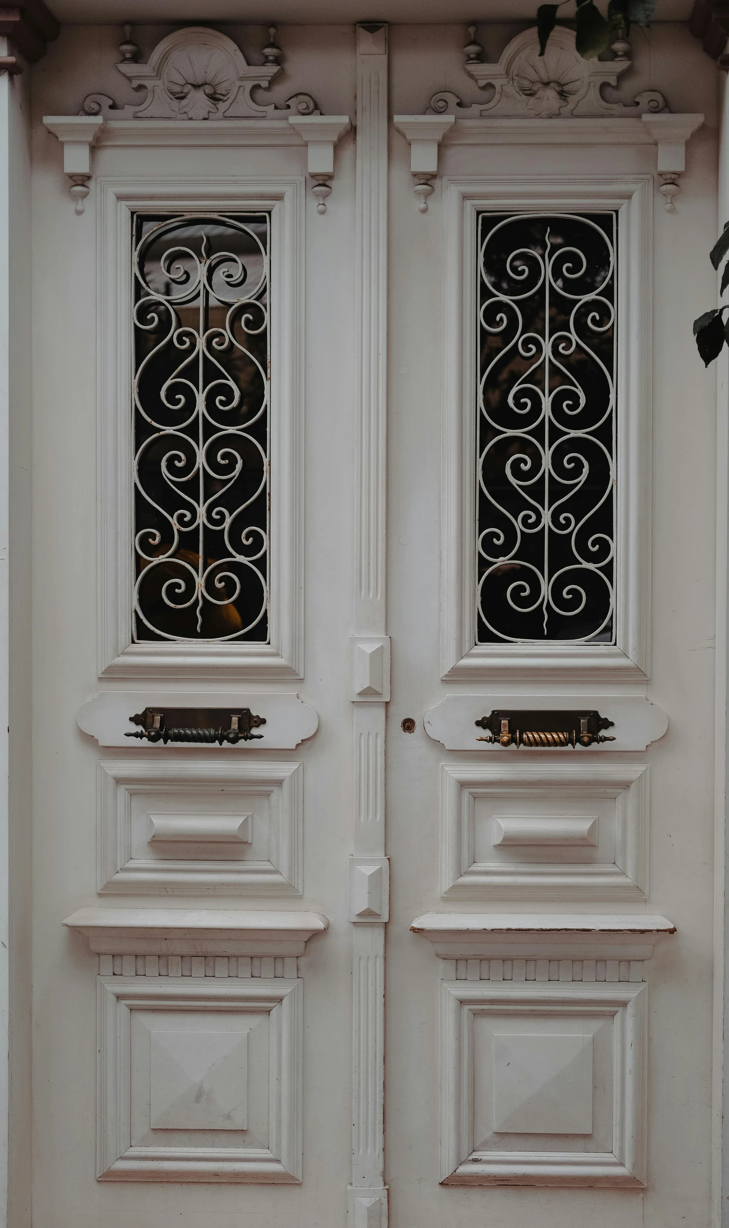 a pair of white doors sitting next to each other