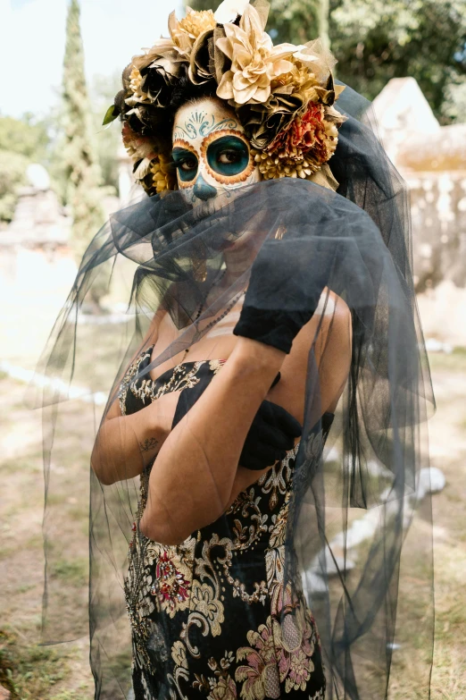 a person wearing a mask and dress posing for the camera