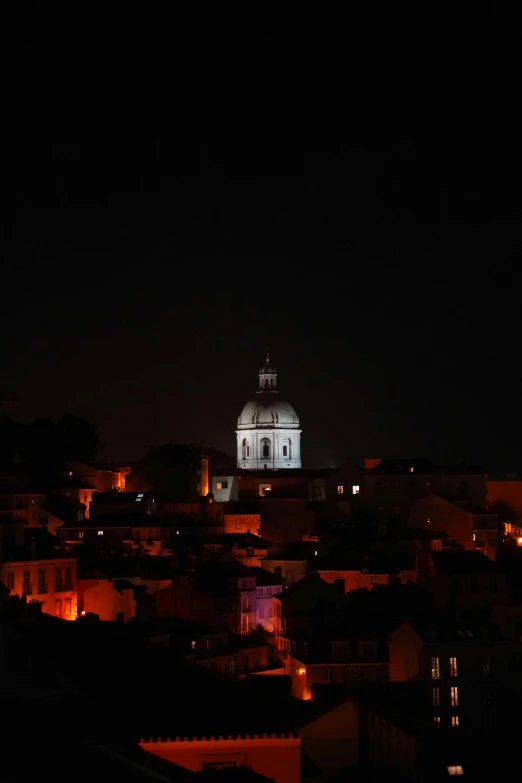 an illuminated building lit up at night in the city