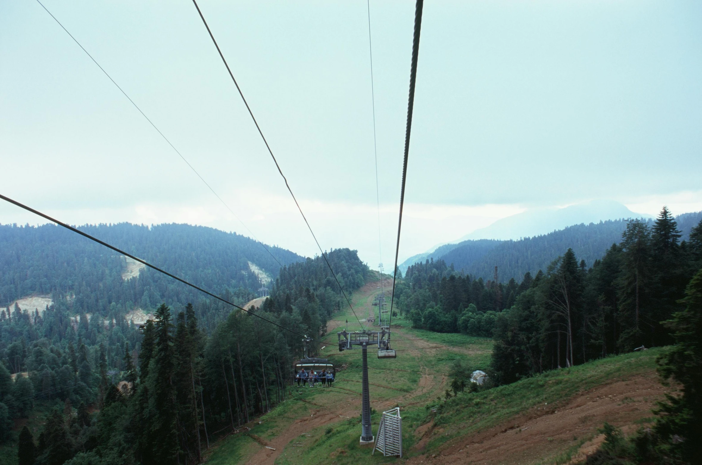 the cable cars are going up the hill