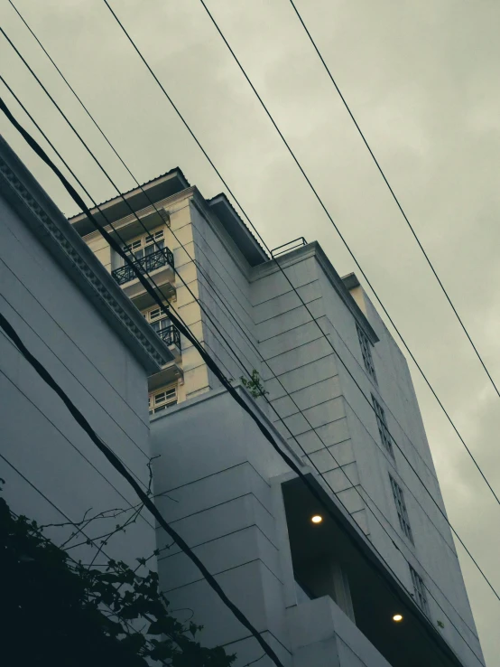 a tall building with a clock mounted to the side of it