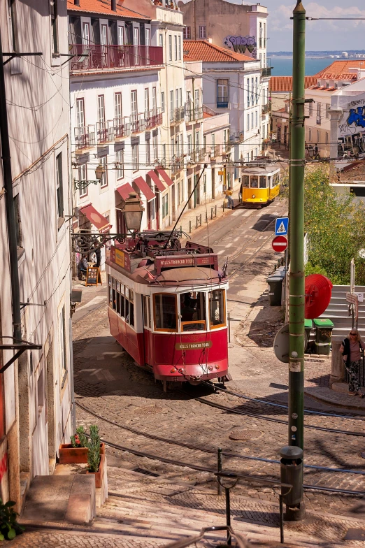 old tram on tracks near an urban area