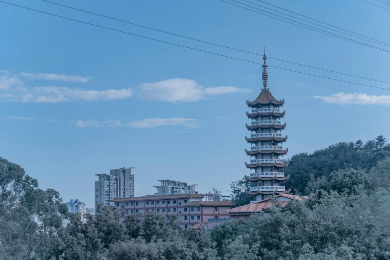 the tall tower is seen above the buildings