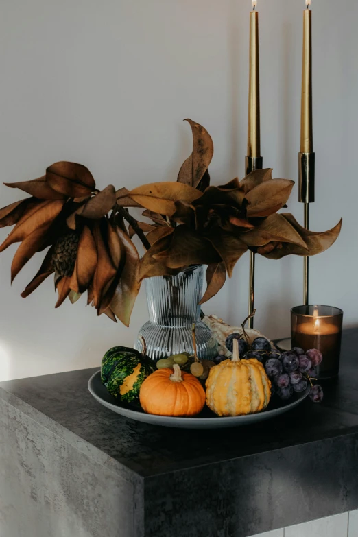 a table topped with a plate full of fruits and vegetables