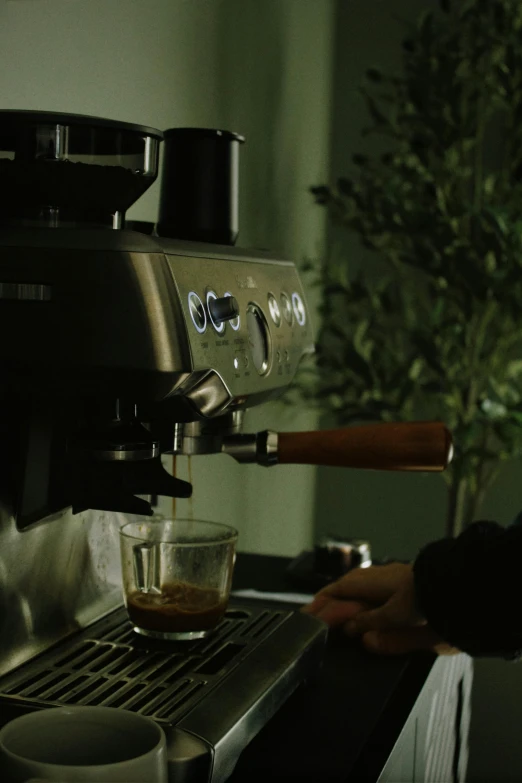 a person is pouring soing into a glass