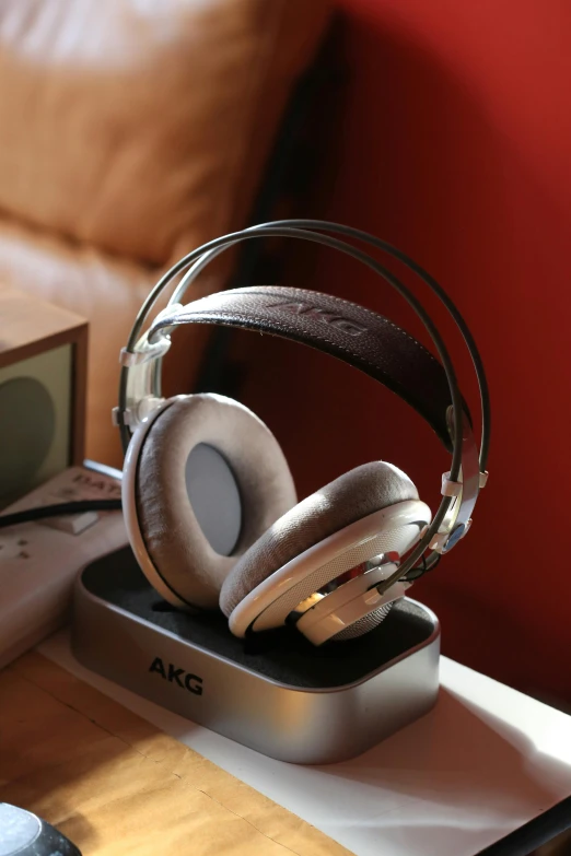 an assortment of headphones in a metal container