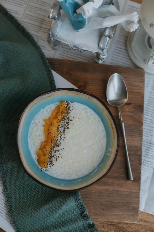 rice and milk in a bowl on a table