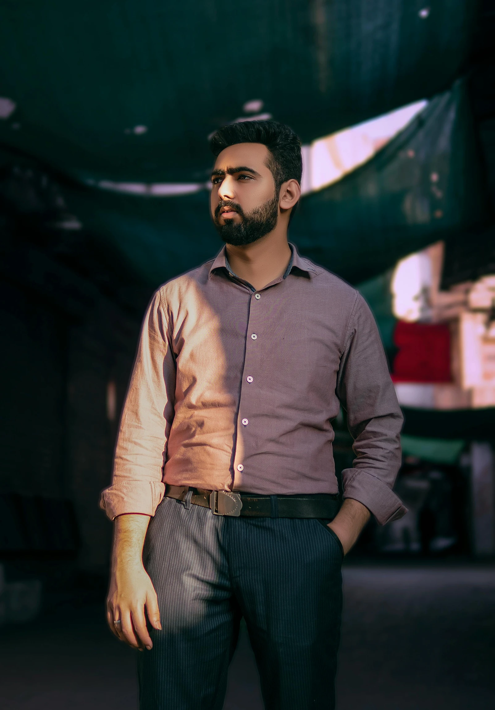 a man stands in a warehouse like area