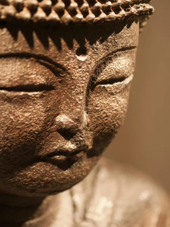 the head of a buddha statue is made from stone