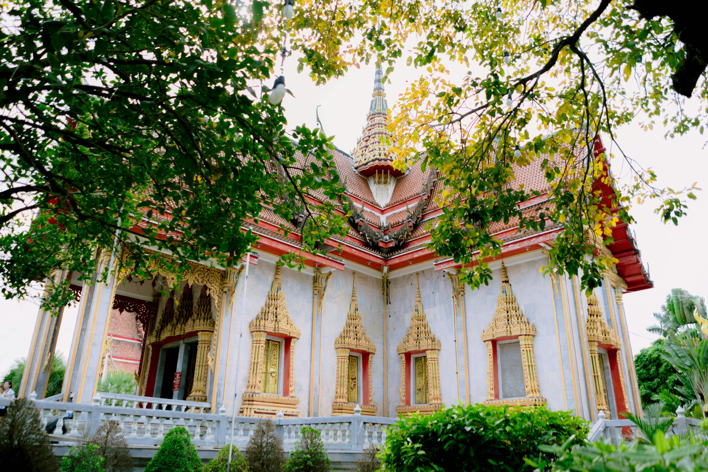 an ornately painted building with white balusts