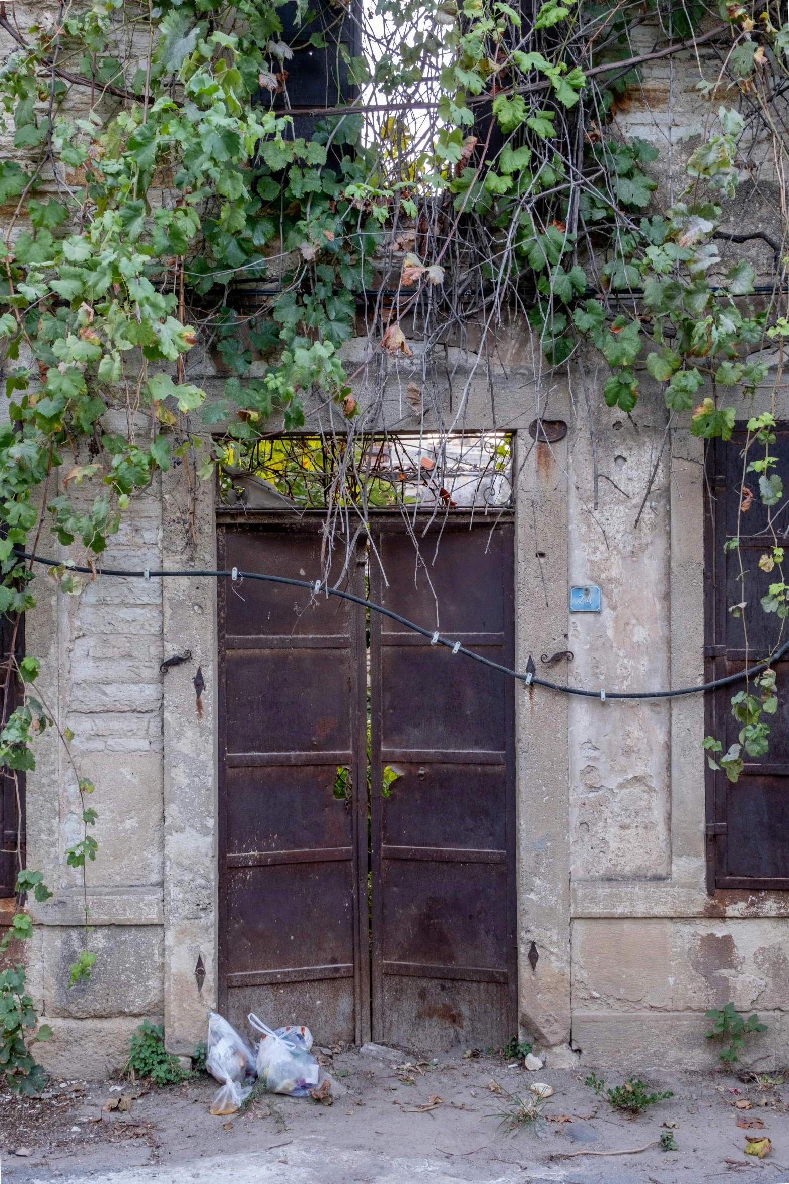 a couple of large doors sitting in front of a building