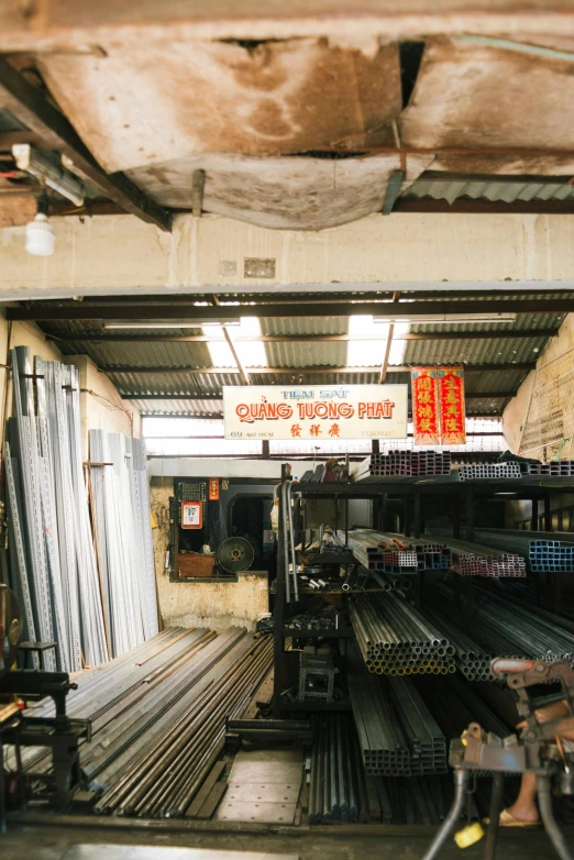 there is an indoor market with a long row of vendors