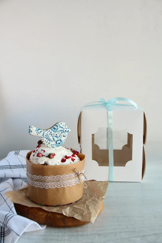 a cake with a small bird decoration on top of it