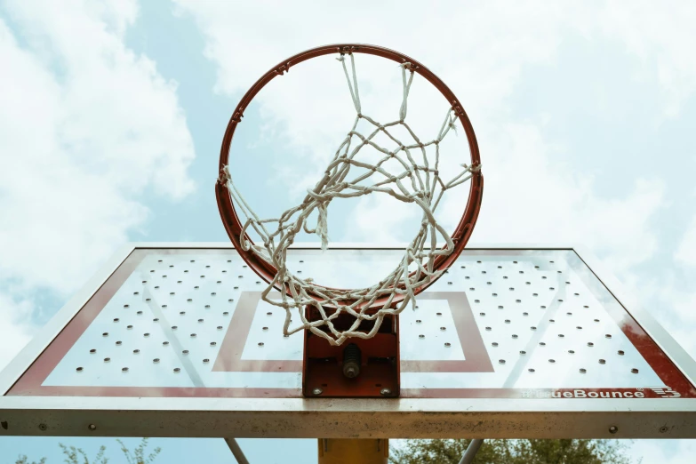 a basketball is flying through the net to make it into the hoop