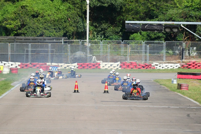 an image of group of people racing cars