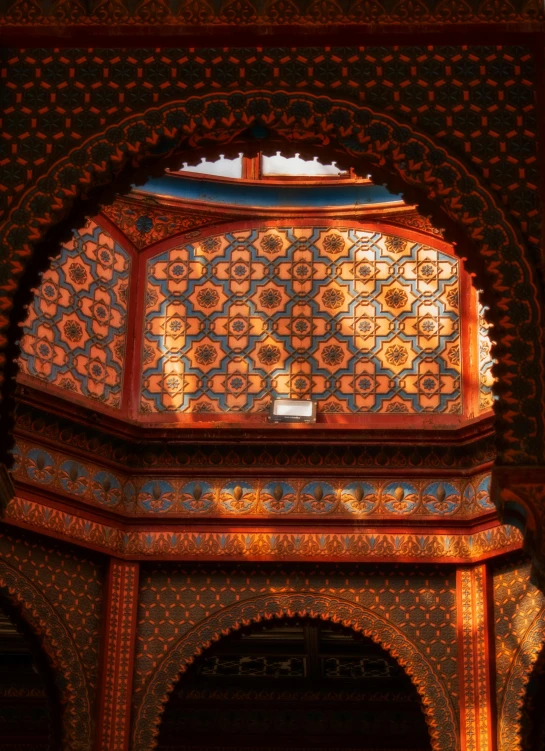 a large ornate wooden archway with bright lights