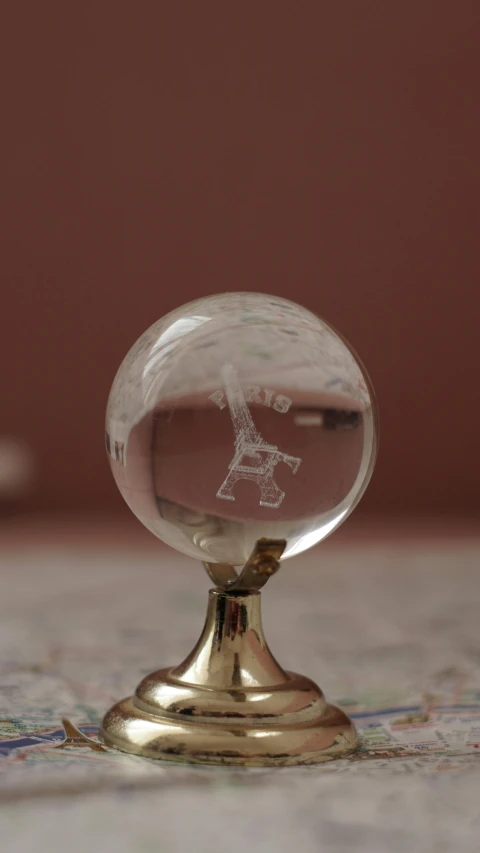 small glass sphere on top of a ss stand