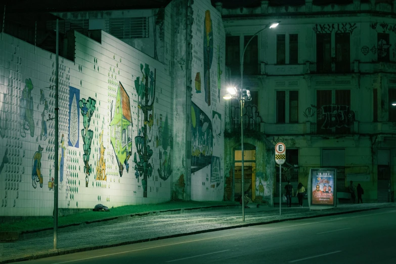 some buildings on the side of the road at night