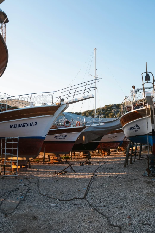 several different types of boats docked next to each other