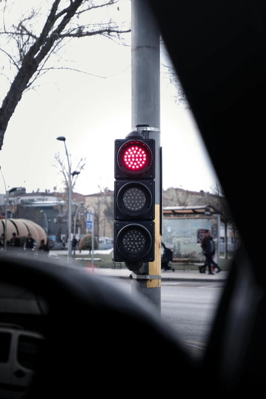 a stop light is at the top of the street