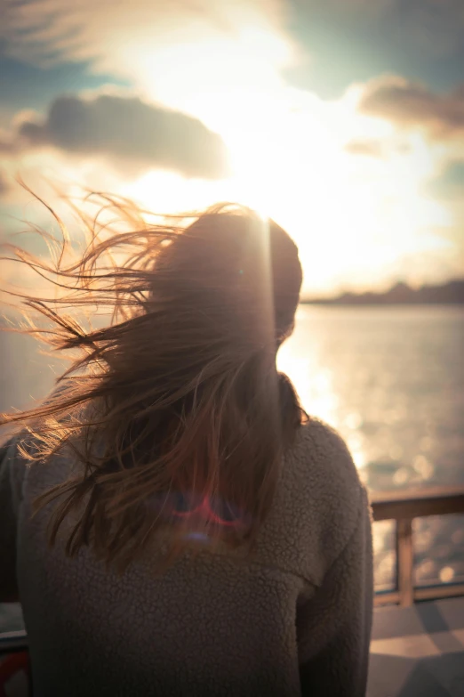 the back end of a girl's head and long hair