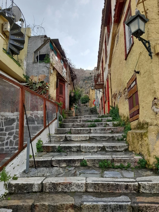 some steps lead up a set of steep cobblestone streets