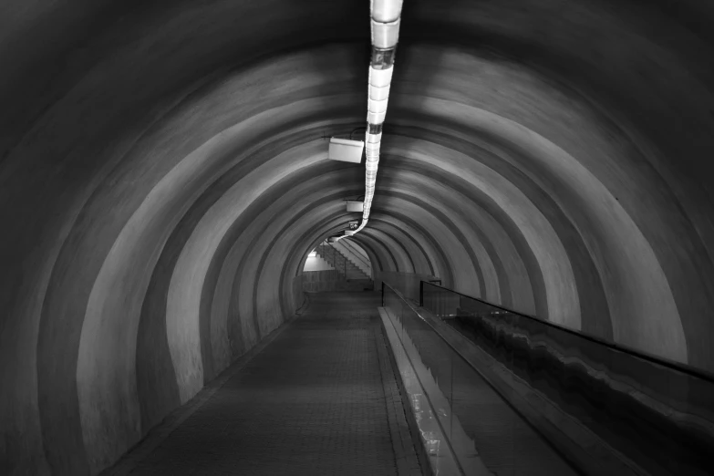 this black and white po shows the light in a subway