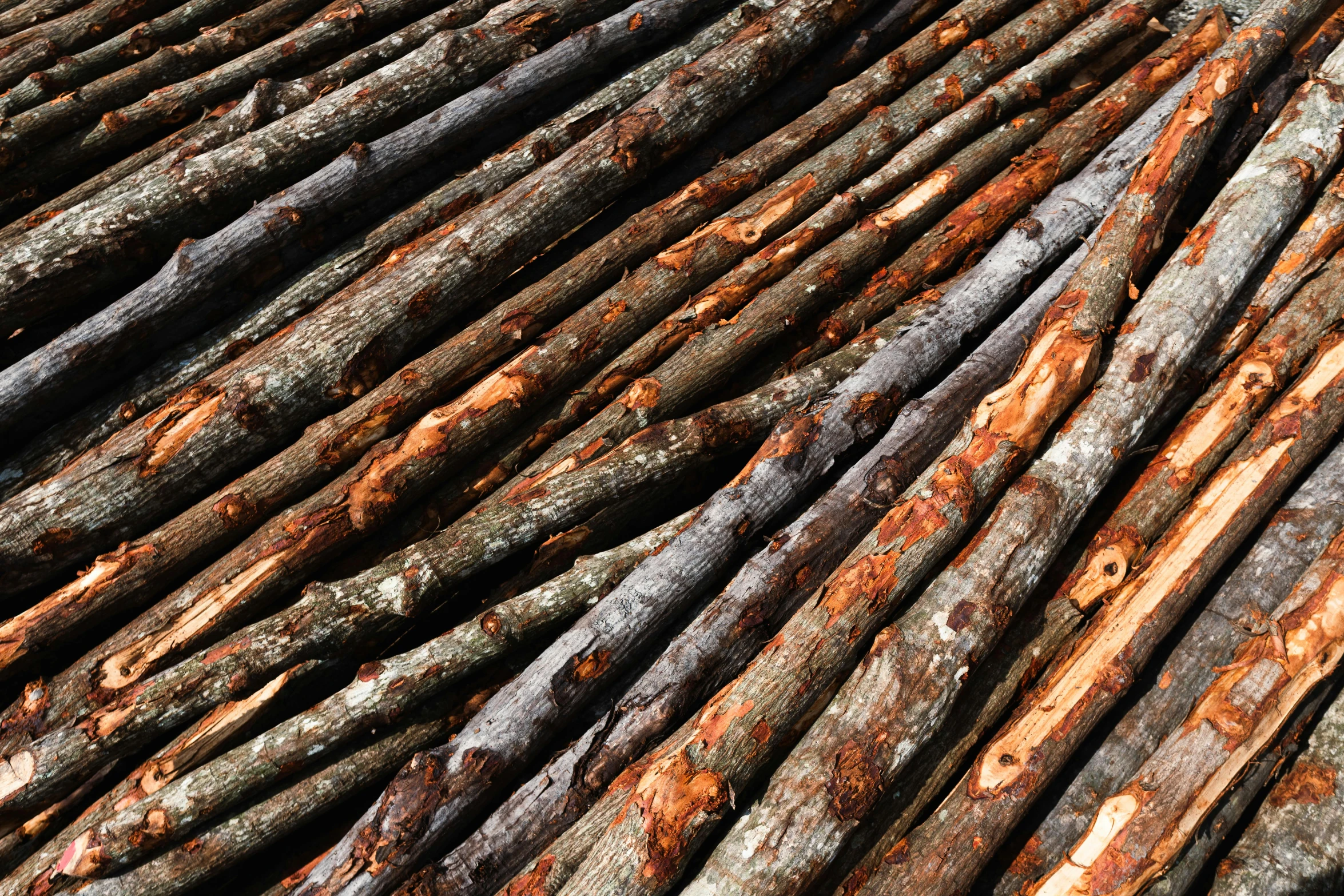 multiple large pieces of old wood piled on top of each other