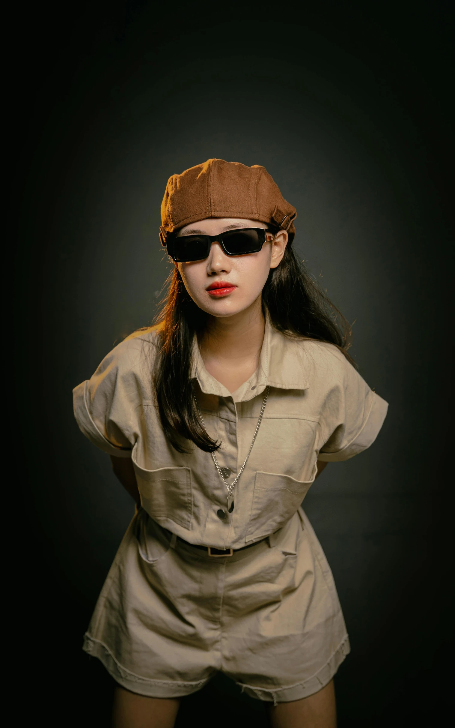 a young lady dressed as a woman with sunglasses