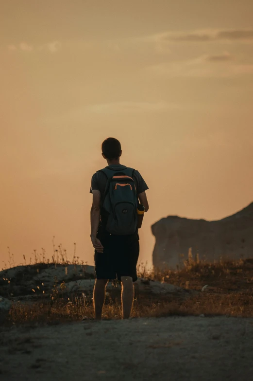 a person standing on a dirt road