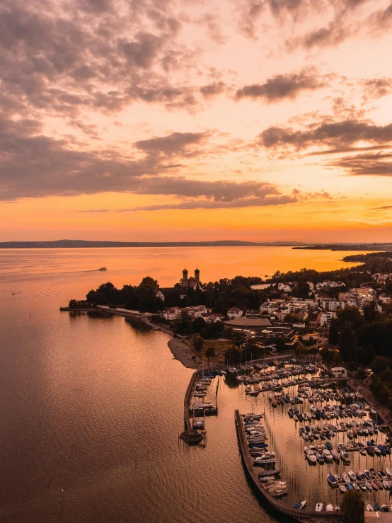 a view of boats docked at a marina at sunset