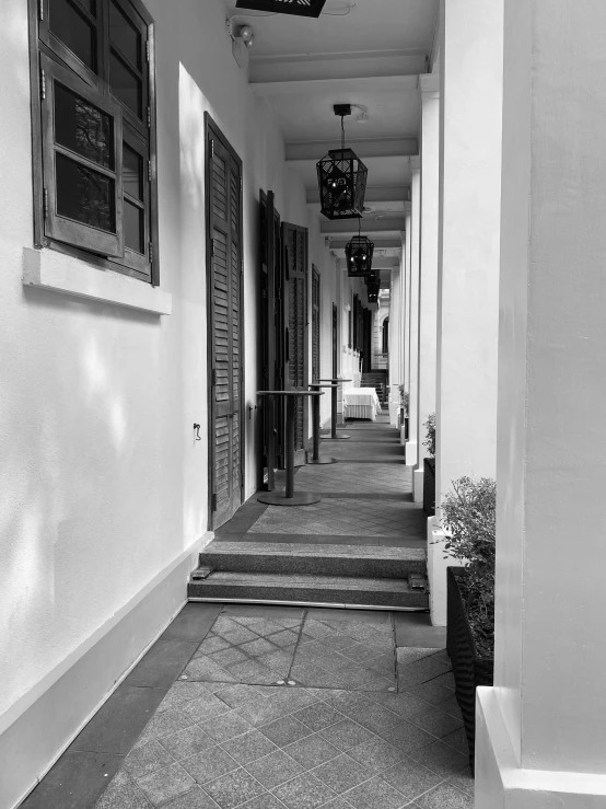 black and white pograph of hallway with open doors