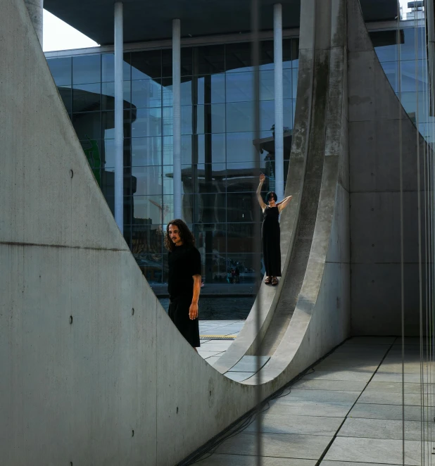 two people doing tricks on skateboards in the park