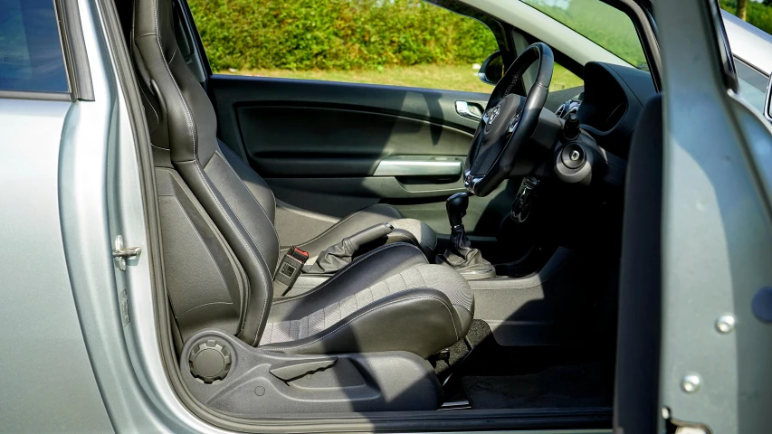 small car with interior door open from inside